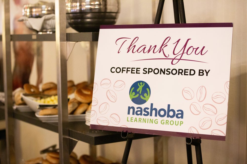 A thank you sign beside the refreshments reading coffee sponsored by Nashoba Learning Group